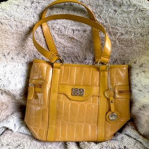 Bueno purse features credit card slots ID window key ring glass and phone case